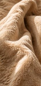 Puha, prémium bézs textil textúra lágy napfényben a Glow Creative hangulattábláján